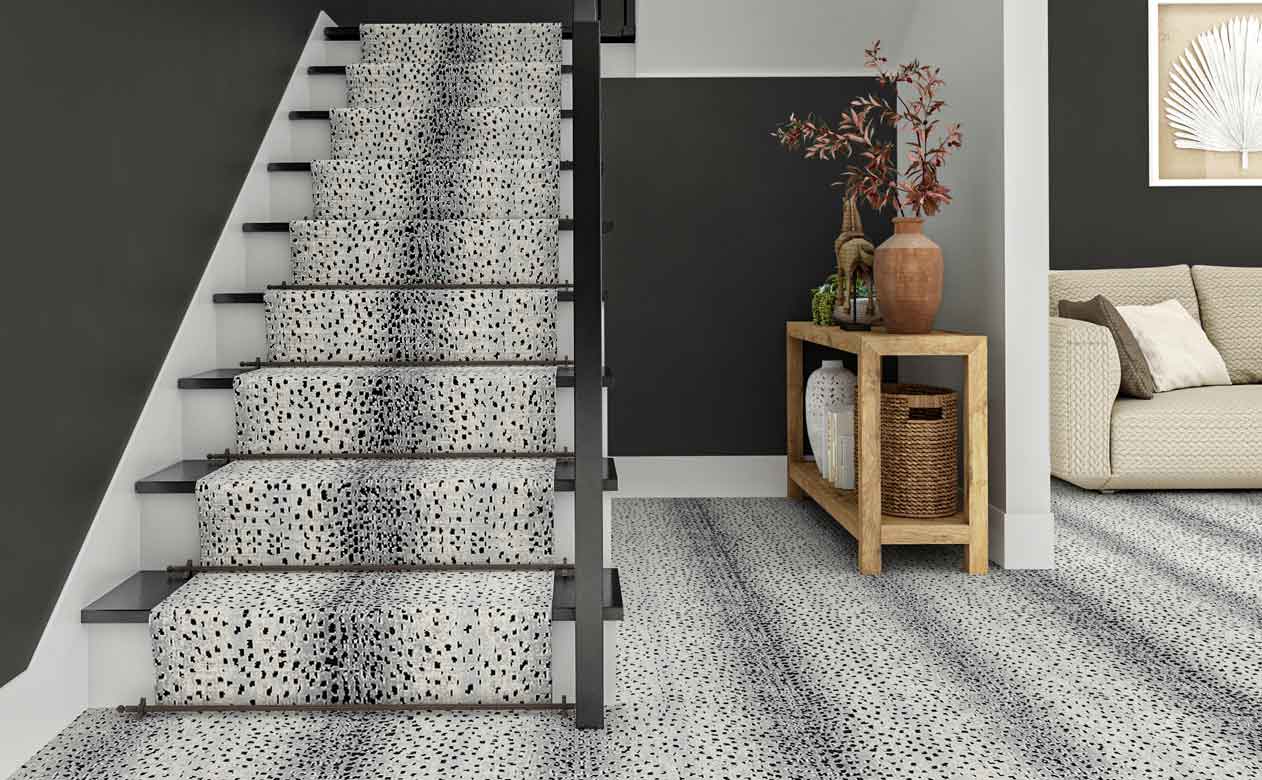 White animal pattern rug and runner on staircase. 